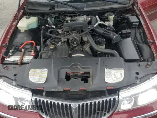 1999 Lincoln Town Car Signature with VIN 1LNHM82W7XY612906, listed as a Copart auction lot 50777435 with 110,414 mi miles and Salvage title. Bid and sale history available at DreamBid. Image 11.