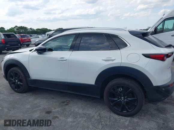 2024 Mazda CX-30 Premium z VIN 3MVDMBDY7RM706554, wystawiony jako IAAI lot #42322863 z przebiegiem 2817 mil mil oraz . Historia ofert i sprzedaży dostępna na DreamBid. Obrazek 14.