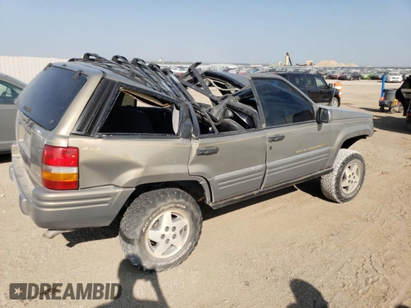 1998 Jeep Grand Cherokee Limited with VIN 1J4GZ78Y2WC146974, listed as a Copart auction lot 71435484 with 192,996 mi miles and Salvage Title. Bid and sale history available at carsss.com. Image 3.