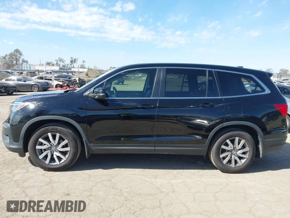 2020 Honda Pilot EX-L with VIN 5FNYF5H54LB009448, listed as a IAAI auction lot 41697106 with 63,310 mi miles. Bid and sale history available at carsss.com. Image 14.