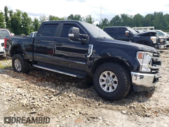 2020 Ford F-250 XL with VIN 1FT8W2BTXLEE30615, listed as a Copart auction lot 60626295 with 142,318 mi miles and Salvage title. Bid and sale history available at DreamBid. Image 4.