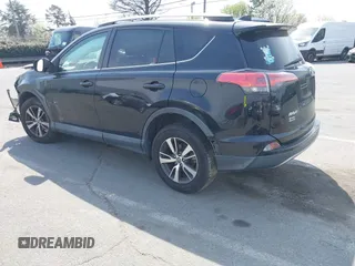 2018 Toyota RAV4 XLE with VIN 2T3RFREV6JW734993, listed as a IAAI auction lot 41790232 with 61,118 mi miles. Bid and sale history available at carsss.com. Image 3.