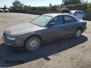 1997 Mazda Millenia z VIN JM1TA2213V1308406, wystawiony jako Copart lot #74141674 z przebiegiem 205 115 mil mil oraz Tytuł czysty. Historia ofert i sprzedaży dostępna na DreamBid. Obrazek 1.