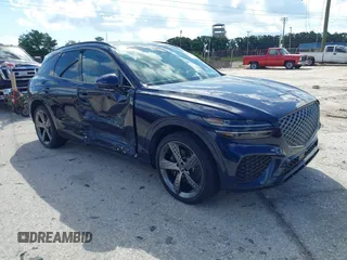 2022 Genesis GV70 Sport z VIN KMUMCDTC2NU061594, wystawiony jako IAAI lot #42244003 z przebiegiem 6 530 mil mil oraz . Historia ofert i sprzedaży dostępna na DreamBid. Obrazek 1.