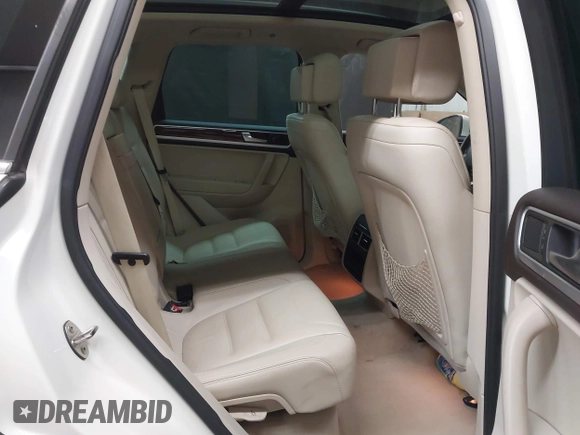 2012 Volkswagen Touareg Sport with VIN WVGFK9BP2CD002991, listed as a IAAI auction lot 42077523 with 94,515 mi miles and . Bid and sale history available at DreamBid. Image 8.