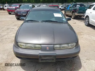 1999 Saturn SW z VIN 1G8ZK8270XZ189484, wystawiony jako IAAI lot #42265580 z przebiegiem 142 257 mil mil oraz . Historia ofert i sprzedaży dostępna na DreamBid. Obrazek 6.