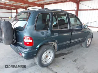 2000 Kia Sportage with VIN KNDJB7232Y5651398, listed as a IAAI auction lot 41678617 with 156,144 mi miles. Bid and sale history available at carsss.com. Image 4.