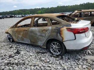 2018 Ford Focus SE z VIN 1FADP3FE4JL265608, wystawiony jako Copart lot #50029575 z przebiegiem Nie podano mil oraz Szkoda całkowita • Salvage title. Historia ofert i sprzedaży dostępna na DreamBid. Obrazek 2.