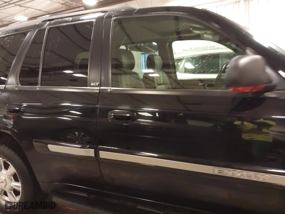 2004 GMC Envoy SLE with VIN 1GKDT13S542265104, listed as a IAAI auction lot 41884797 with 154,190 mi miles. Bid and sale history available at carsss.com. Image 14.