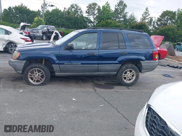 2002 Jeep Grand Cherokee Laredo with VIN 1J4GX48S02C125258, listed as a IAAI auction lot 42388724 with 295,270 mi miles and . Bid and sale history available at DreamBid. Image 14.