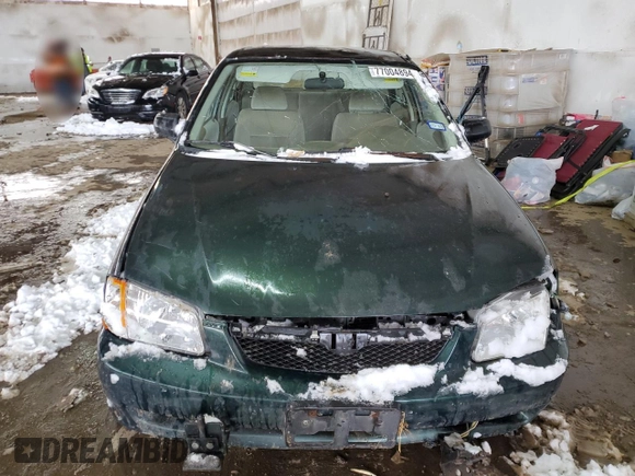 1999 Mazda Protege DX z VIN JM1BJ2220X0108600, wystawiony jako Copart lot #77004894 z przebiegiem 220 836 mil mil oraz Szkoda całkowita • Salvage title. Historia ofert i sprzedaży dostępna na DreamBid. Obrazek 5.