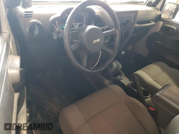 2007 Jeep Wrangler Rubicon z VIN 1J8GA64117L187431, wystawiony jako Copart lot #61293624 z przebiegiem 263 459 mil mil oraz Szkoda całkowita • Salvage title. Historia ofert i sprzedaży dostępna na DreamBid. Obrazek 8.