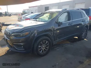 2019 Jeep Cherokee Altitude with VIN 1C4PJMLBXKD194449, listed as a IAAI auction lot 41471507 with 61,107 mi miles. Bid and sale history available at carsss.com. Image 17.