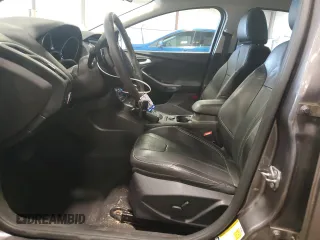 2014 Ford Focus Titanium z VIN 1FADP3N27EL462950, wystawiony jako Copart lot #65207155 z przebiegiem 34 058 mil mil oraz Szkoda całkowita • Salvage title. Historia ofert i sprzedaży dostępna na DreamBid. Obrazek 7.
