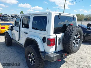 2021 Jeep Wrangler Unlimited Rubicon with VIN 1C4HJXFN9MW519496, listed as a IAAI auction lot 41676845 with 72,767 mi miles. Bid and sale history available at carsss.com. Image 3.