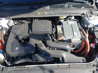 2016 Ford Fusion Titanium Hybrid with VIN 3FA6P0RU1GR259947, listed as a IAAI auction lot 41695377 with 97,605 mi miles. Bid and sale history available at carsss.com. Image 10.