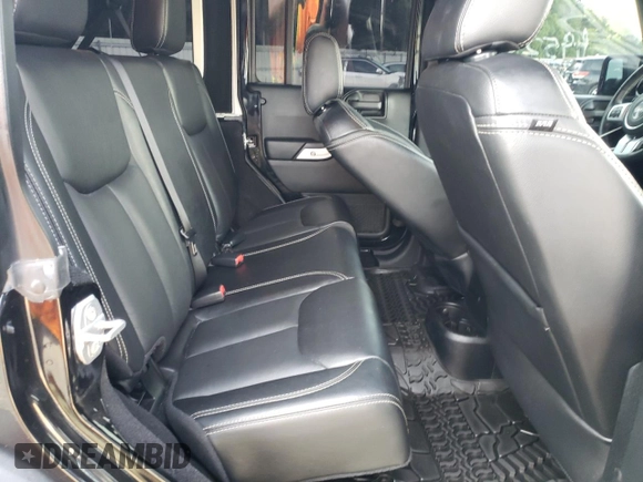2016 Jeep Wrangler Unlimited Rubicon with VIN 1C4HJWFG9GL220687, listed as a Copart auction lot 60552705 with 49,525 mi miles and Salvage title. Bid and sale history available at DreamBid. Image 11.