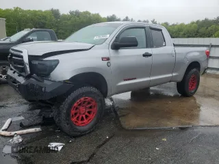 2010 Toyota Tundra with VIN 5TFUY5F15AX123633, listed as a Copart auction lot 57053995 with 85,716 mi miles and Salvage title. Bid and sale history available at DreamBid. Image 1.