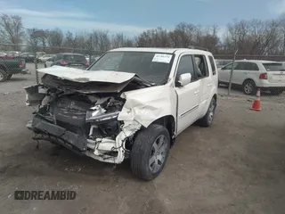 2015 Honda Pilot Touring with VIN 5FNYF4H9XFB047607, listed as a IAAI auction lot 41781534 with 157,252 mi miles. Bid and sale history available at carsss.com. Image 2.