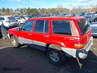 1997 Jeep Grand Cherokee Laredo with VIN 1J4GZ58S0VC550242, listed as a IAAI auction lot 41032114 with 185,307 mi miles. Bid and sale history available at carsss.com. Image 14.