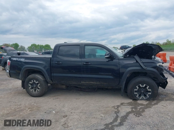 2023 Toyota Tacoma SR with VIN 3TMCZ5AN2PM598464, listed as a IAAI auction lot 42238032 with 35,597 mi miles and . Bid and sale history available at DreamBid. Image 13.
