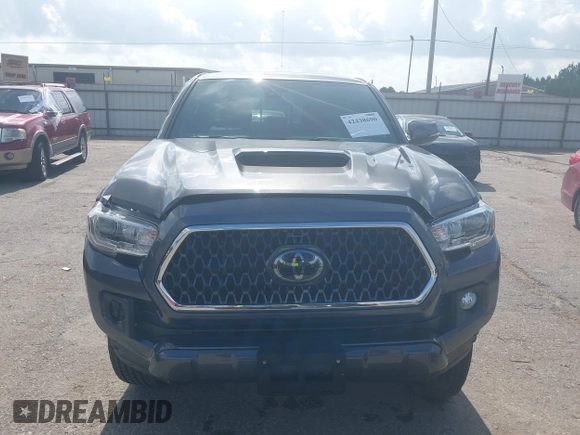 2018 Toyota Tacoma SR5 with VIN 3TMDZ5BN0JM051283, listed as a IAAI auction lot 42438690 with 106,155 mi miles and . Bid and sale history available at DreamBid. Image 12.