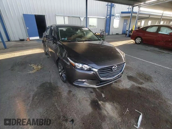 2018 Mazda 3 Touring z VIN 3MZBN1L30JM195471, wystawiony jako Copart lot #57497115 z przebiegiem 147 899 mil mil oraz Szkoda całkowita • Salvage title. Historia ofert i sprzedaży dostępna na DreamBid. Obrazek 13.