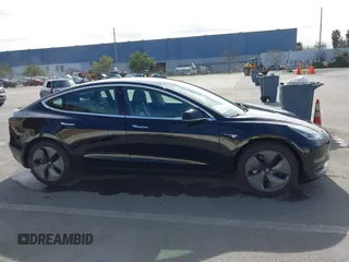 2019 Tesla Model 3 Mid Range with VIN 5YJ3E1EA2KF305834, listed as a IAAI auction lot 41719610 with 126,333 mi miles and . Bid and sale history available at DreamBid. Image 13.