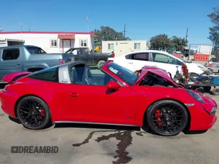 2016 Porsche 911 4S z VIN WP0BB2A99GS136573, wystawiony jako IAAI lot #42238845 z przebiegiem 13 464 mil mil oraz . Historia ofert i sprzedaży dostępna na DreamBid. Obrazek 13.