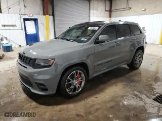 2021 Jeep Grand Cherokee SRT with VIN 1C4RJFDJ5MC667774, listed as a Copart auction lot 42484435 with 43,387 mi miles and Salvage Title. Bid and sale history available at carsss.com. Image 1.