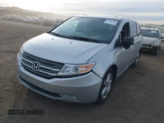 2012 Honda Odyssey Touring with VIN 5FNRL5H96CB095264, listed as a IAAI auction lot 41403450 with 246,199 mi miles and . Bid and sale history available at carsss.com. Image 2.