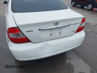 2003 Toyota Camry LE z VIN JTDBF30K530148403, wystawiony jako IAAI lot #41688346 z przebiegiem 299 143 mil mil oraz . Historia ofert i sprzedaży dostępna na DreamBid. Obrazek 6.