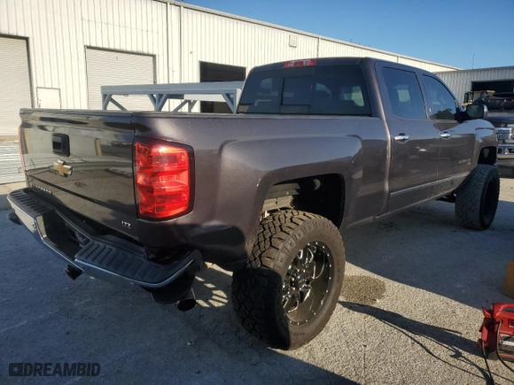 2014 Chevrolet Silverado 1500 LTZ with VIN 1GCUKSECXEF193272, listed as a Copart auction lot 82775984 with 154,131 mi miles and Salvage Title. Bid and sale history available at carsss.com. Image 3.