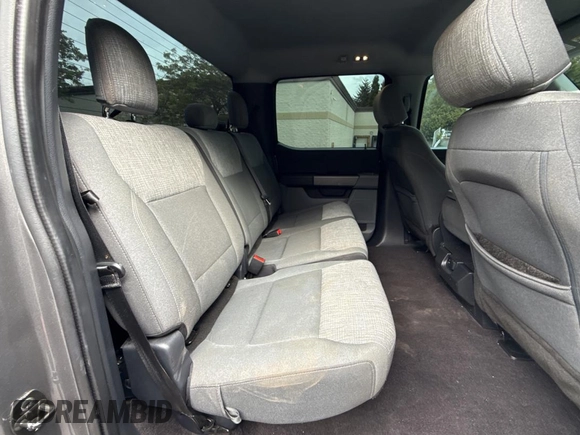 2021 Ford F-150 XL with VIN 1FTFW1E86MKD57397, listed as a Copart auction lot 62959355 with 59,227 mi miles and Salvage title. Bid and sale history available at DreamBid. Image 6.