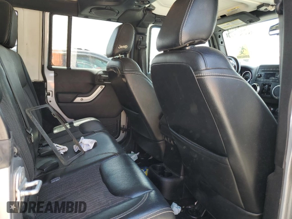 2013 Jeep Wrangler Unlimited Sport with VIN 1C4BJWDG4DL628518, listed as a Copart auction lot 65029795 with 142,852 mi miles and Salvage title. Bid and sale history available at DreamBid. Image 10.