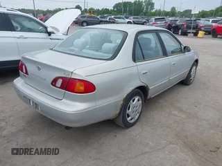 1999 Toyota Corolla VE z VIN 2T1BR12E7XC154444, wystawiony jako IAAI lot #42514069 z przebiegiem 209 377 mil mil oraz . Historia ofert i sprzedaży dostępna na DreamBid. Obrazek 4.