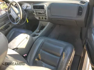2001 Ford Explorer Sport z VIN 1FMYU70E51UB97037, wystawiony jako Copart lot #76293004 z przebiegiem 130 458 mil mil oraz Szkody całkowita. Historia ofert i sprzedaży dostępna na DreamBid. Obrazek 8.
