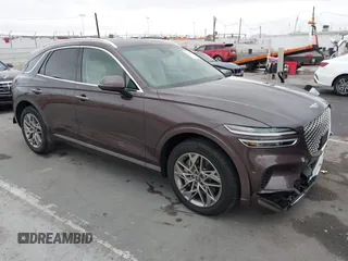 2023 Genesis GV70 2.5T z VIN KMUMADTB8PU114752, wystawiony jako IAAI lot #42184620 z przebiegiem 21 135 mil mil oraz . Historia ofert i sprzedaży dostępna na DreamBid. Obrazek 1.