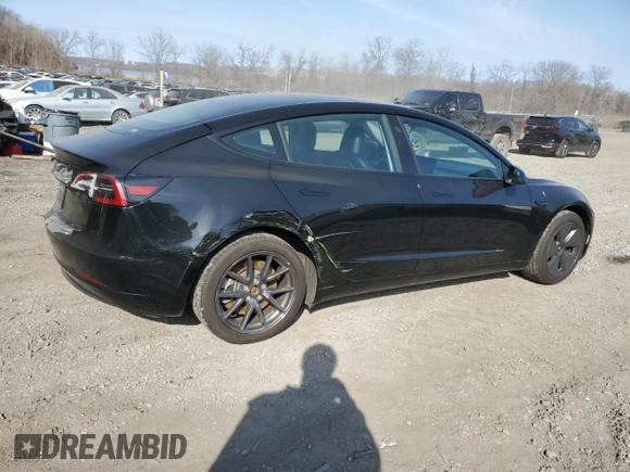 2023 Tesla Model 3 with VIN 5YJ3E1EA3PF670787, listed as a Copart auction lot 49070865 with 13,489 mi miles and Salvage title. Bid and sale history available at DreamBid. Image 3.