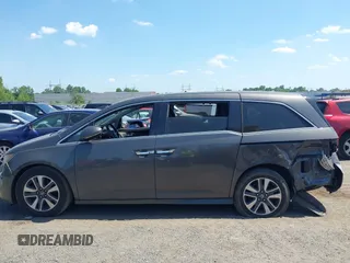 2014 Honda Odyssey Touring with VIN 5FNRL5H90EB082691, listed as a IAAI auction lot 42572977 with 54,413 mi miles and . Bid and sale history available at DreamBid. Image 14.