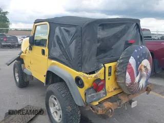 2005 Jeep Wrangler SE z VIN 1J4FA29S95P373313, wystawiony jako IAAI lot #42340611 z przebiegiem 162 801 mil mil oraz . Historia ofert i sprzedaży dostępna na DreamBid. Obrazek 3.