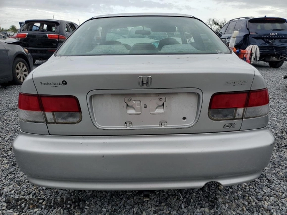1999 Honda Civic EX z VIN 1HGEJ8241XL039353, wystawiony jako Copart lot #59477965 z przebiegiem 181 477 mil mil oraz Nie do naprawy • Non repairable. Historia ofert i sprzedaży dostępna na DreamBid. Obrazek 6.