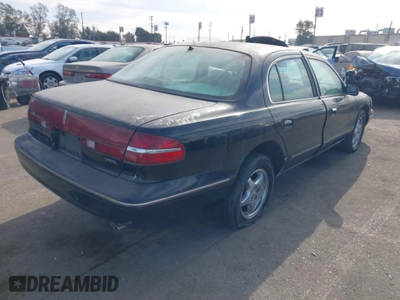 1997 Lincoln Continental with VIN 1LNLM97V5VY665410, listed as a IAAI auction lot 41239128 with 66,873 mi miles. Bid and sale history available at carsss.com. Image 4.