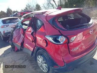 2014 Mazda CX-5 Touring z VIN JM3KE2CY2E0364488, wystawiony jako IAAI lot #41635188 z przebiegiem 127 688 mil mil oraz . Historia ofert i sprzedaży dostępna na DreamBid. Obrazek 6.