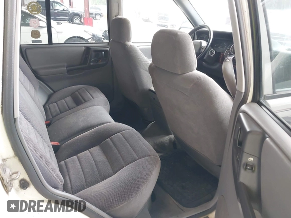 1997 Jeep Grand Cherokee Laredo z VIN 1J4GZ58S7VC737980, wystawiony jako IAAI lot #42256142 z przebiegiem 188 958 mil mil oraz . Historia ofert i sprzedaży dostępna na DreamBid. Obrazek 8.