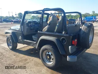 2004 Jeep Wrangler SE with VIN 1J4FA29144P797861, listed as a IAAI auction lot 42624721 with 156,867 mi miles and . Bid and sale history available at DreamBid. Image 3.