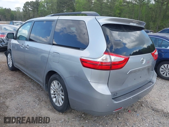 2015 Toyota Sienna XLE with VIN 5TDYK3DC7FS659864, listed as a IAAI auction lot 41958112 with 121,257 mi miles and . Bid and sale history available at DreamBid. Image 3.