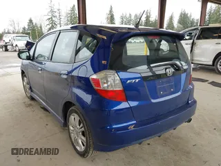 2009 Honda Fit Sport with VIN JHMGE88459C001743, listed as a IAAI auction lot 41852048 with 128,225 mi miles. Bid and sale history available at carsss.com. Image 3.