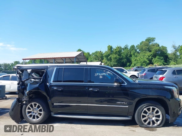2015 GMC Yukon XL Denali with VIN 1GKS2JKJ9FR244754, listed as a IAAI auction lot 39706952 with 94,917 mi miles. Bid and sale history available at carsss.com. Image 14.