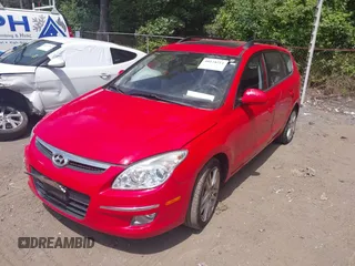 2010 Hyundai Elantra Touring SE with VIN KMHDC8AE2AU075841, listed as a IAAI auction lot 40128211 with 173,541 mi miles. Bid and sale history available at carsss.com. Image 2.